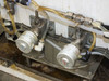 Dual diaphragm valve manifold detail – two valves with tubing connections mounted on stainless bracket inside frame