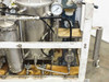 Right-side view of lacquer dispensing system frame showing stainless containers, pressure gauges, manifold, and PUM1 label
