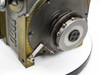 Sankyo Sandex indexing drive – rear flange output face view showing large circular output flange with bolt pattern and proximity sensor bracket