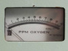 Close-up of TAI PPM Oxygen analog meter face showing 0–10 PPM scale with CAL marker — SPI Instruments Co. meter