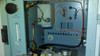 Interior view of Teledyne 316 meter enclosure showing CELL SHUT OFF valve, FLOW indicator, internal plumbing, wiring harness, and terminal block