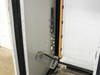 Interior left side panel of 38U rack cabinet showing power strip wiring, binding posts, and cable management