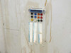 Interior panel of rack cabinet showing DB-25 connector and multicolor binding post terminal strip with tape labels