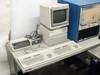 HP 9000 300 Series workstation with CRT monitor, HP 9153C disk drive, HP Thinkjet printer, and keyboard — close-up view of computer station