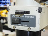 Olympus BH2-UMA nameplate close-up — showing model designation BH2-UMA and f=180 focal length specification