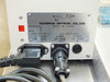 Olympus TGH rear panel rating plate — showing Model TGH, serial number 216462, Olympus Optical Co. Ltd., Made in Japan, 100/115V 0.7/0.6A 50-60Hz, lamp out 12V 50W, fuse 7A FAST