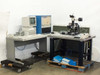 Nano Instruments Nanoindenter system overview — full lab setup showing control cabinet, HP 9000 workstation desk, and indenter microscope stage on isolation table
