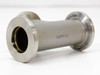 KF25 vacuum tee fitting side profile showing cylindrical body with 'TAIWAN' stamp and two end flanges; light surface marks on body