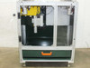Uni-Solar MX1-711-000-5 corner trim machine — front view with safety guards open showing cutting head assembly and scrap collection drawer