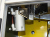 Uni-Solar MX1-711-000-5 — internal view showing SMC CG1UN50-25 pneumatic cylinder mounted to yellow frame with blade holder assembly