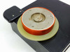 Dowty TC-48 top view of heated winder/coil wheel — orange outer ring with cream-colored base disc and central metal hub with mounting screws