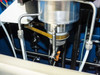 Underside of quartz reactor assembly showing reactor base, gas line connections, susceptor mount, and orange sensor