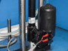 Close-up of Funak peristaltic/diaphragm pump and associated gas line plumbing inside lower cabinet