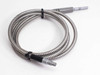 Lumatec fiber optic microscope light guide full length view laid out coiled on white surface, both barrel connectors visible, stainless armor jacket with black cable-tie holders
