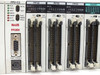 NAIS FP2-C2 CPU (FP2SH) and three PP42 positioning modules closeup — showing RUN/PROG/TEST/BREAK/ERROR/BATT/ALARM LEDs, RS-232C COM port, and CN1/CN2 ribbon connectors