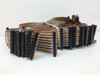 Large bundle of rainbow ribbon cables with IDC connectors included with the backplane — laid flat on white background