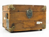 Winslow Co Type 301 cable fault tester — side view of closed oak case showing front latch, brass corner protectors, and paper labels