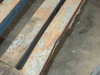 Close-up of heavily rusted and pitted steel deck slat surface with chipped blue paint on Cost Cutter delivery cart