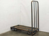 Cost Cutter industrial steel delivery cart full side view showing 59x29 slatted platform and tall removable upright backboard with 3 vertical bars