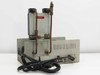 CEC 26-303 Moisture Monitor rear and side view showing copper gas tubing connections, rear panel with AC cord, recorder terminals, and ventilation slots