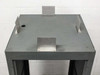 Top view of rackmount cabinet showing steel top panel with cable pass-through hole and four metal mounting brackets