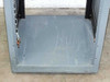 Interior floor of rackmount cabinet showing heavy gauge steel base plate with surface scratches and chain latch on left rail