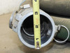 Interior bore of 2-inch aluminum cam lock coupling measured with tape measure showing approximately 2-inch diameter