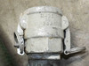 Aluminum cam lock coupling stamped MADE IN USA — close-up of casting