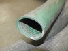 Cross-section view of hose end showing green inner liner and corrugated outer jacket construction