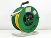 In-Situ PXD-260 pressure transducer on green cable storage reel with yellow polyurethane cable and metal stand – front-left view