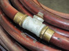 Thermoid Cobra fuel oil hose – galvanized tee fitting close-up showing dual brass unions and vent/bleed port on top