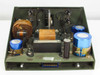 PTC 10190-A interior — top-down view from slightly different angle showing wound transformer cores, filter capacitors, inductor, wiring, and multi-pin edge connector at rear