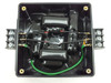 Control Concepts Islatrol IC+107 — interior view with cover removed showing two toroidal inductors, capacitors, and wiring including green ground wire