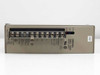 Omron S82L-1024 Power Supply – top/terminal side view showing screw terminal block array and rating label