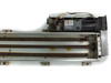 Yamaha LS1BL-850 top view with drive motor assembly visible at one end, ball screw and guide rails showing rust throughout