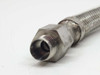 Close-up of straight hex NPT fitting end — duplicate angle showing bore and oxidation detail