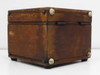 Side and rear view of wooden case showing significant surface scratches, scuffs, and aged patina on all panels with rubber feet visible