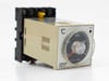 Omron E5C2 temperature controller front and side view mounted on P2CF-08 base, analog dial showing °C scale, ON indicator LED