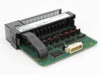 Allen Bradley 1746-OB16 SLC 500 output module – top-down angled view showing PCB components, ICs, output terminals, and ribbon cable