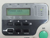 Kyocera Mita FS-9500DN control panel closeup — LCD displaying 'Please wait', navigation buttons, and GO button