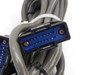 Close-up of blue D-sub style multi-pin connector end on interconnect cable — pin detail visible