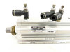 SMC CDQ2KB32-35DM cylinder – angled view showing label with model number and max pressure specs, inventory labels visible