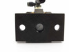 SMC pneumatic cylinder assembly — end view of rear mounting block with center port and two side mounting holes