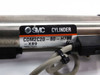 SMC CDM2C20-80-H7BL-XB9 cylinder label closeup showing model number, max pressure rating, and SMC branding