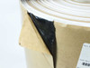 Schnee-Morehead 51959012 butyl adhesive tape — side angle showing black adhesive exposed beneath peeled kraft paper liner