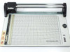 Rotatrim Professional M15 rotary paper trimmer — front view showing cutting table, grid, and Mastercut II head