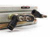 SMC cylinder side view – push-in pneumatic fittings and flow control valves with visible rust and wear on housing surface