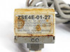 SMC ZSE4E-01-27 label close-up showing model number, wiring diagram, NPN 30V 80mA outputs, 12-24VDC supply, max -101 kPa, Made in Japan