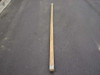 US Tucker Mfg Co military wood ridge tent pole, 9 feet long, laid flat on pavement — full length overhead view showing natural wood and metal end cap