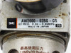 SMC AW2000-02BG-CR label close-up showing model number, set pressure 0.05–0.85 MPa, and Made in Japan marking